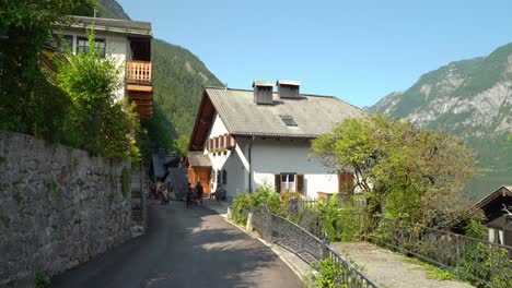 Family-Pushes-Strolley-on-the-Main-Street-of-Hallstatt