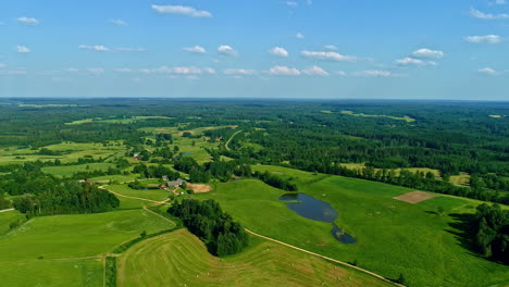 Aerial-view-of-National-park-reserve,-drone-flying-downwards-to-Latvia-beautiful-scenery