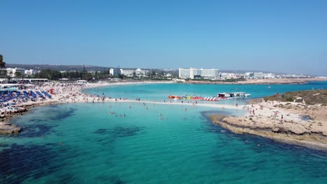 Nissi-Beach-Island-and-Water-Sports-Center-in-Ayia-Napa,-Cyprus