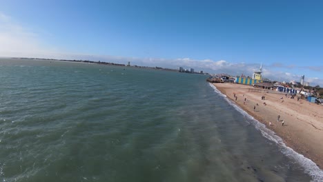 cinematic-fpv-aerial-video-of-a-long-and-wide-beach-on-the-coast-of-south-england-during-a-hot-and-sunny-day-in-england