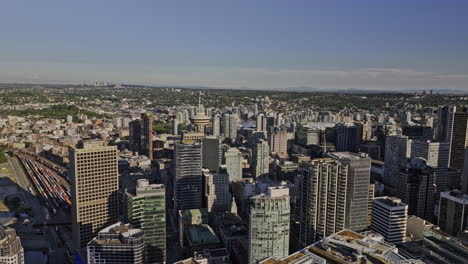 Vancouver-BC-Canada-Aerial-v36-drone-flyover-downtown-capturing-urban-cityscape,-Centerm-container-terminal-shipyard,-harbour-and-North-shore-mountain-views---Shot-with-Mavic-3-Pro-Cine---July-2023