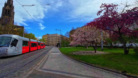 Slowmotion-dolley-view-of-a-modern-tram-standing-in-the-city-centre-of-Prague