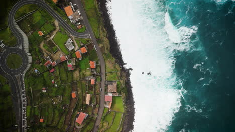 drone-overview-of-Sao-Vicente-village,-sea,-waves,-from-above,-Madeira-aerial-view