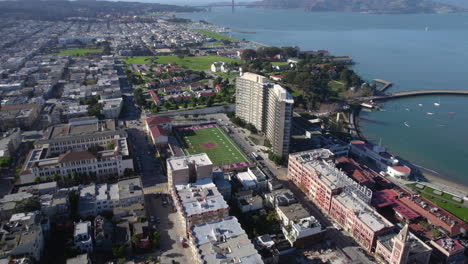 San-Francisco-USA,-Aerial-View-of-Fort-Mason-District,-Buildings-and-Galileo-Academy-Field-Stadium,-Drone-Shot