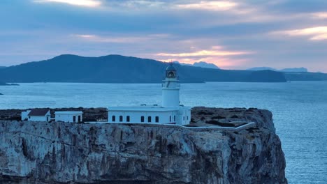 Panoramic-travel-Spanish-location-at-Cavalleria-lighthouse-north-of-Menorca-Sea-background,-sunset-skyline,-famous-cliff