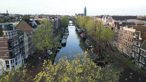 Narrow-Canals-of-Amsterdam,-Netherlands---Cinematic-Establishing-Drone-Shot