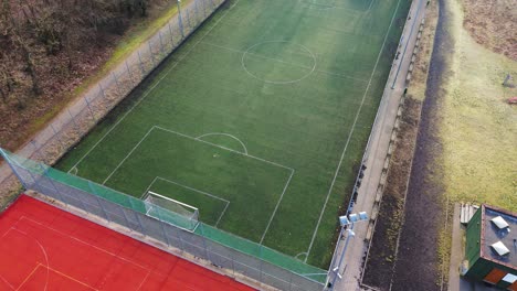 Aerial-view-of-sports-court,-and-football-pitch-in-a-public-park