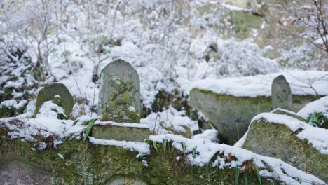 Snow-on-Buddhist-Statues-in-the-Forest-at-Yamadera-Temple,-Japan