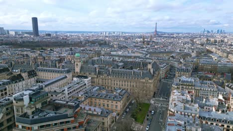 Sorbonne-University-with-Tour-Eiffel-and-Montparnasse-tower-in-background,-Paris-cityscape,-France