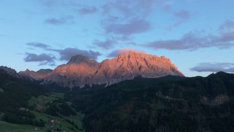 Aerial-evening-slow-orbit-view-of-the-Sas-dles-Nü-mountains-covered-in-clouds