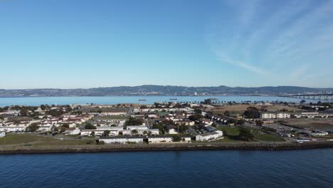 Drone-Footage-Slowly-Ascensding-and-Zooming-Out-with-houses-of-Treasure-Island-in-the-background