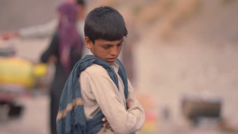 Shot-of-Pakistani-boy-standing-in-Iftar-Drive-for-food-Distribution-to-Poor-People-of-Balochistan-in-Pakistan