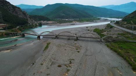 Historic-Bridge-of-Mat-in-Albania-from-the-Past-Century:-Arching-Concrete-and-Iron-Over-the-River-Flowing-from-the-Mountains