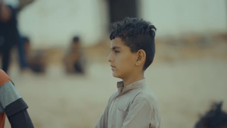 Side-view-of-a-cute-little-young-Balochistan-boy-in-Pakistan