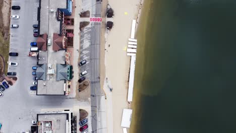 flyover-of-a-small-beach-town-in-the-midwest-during-winter