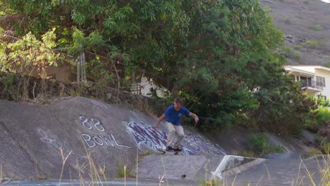 Skateboarding-trick-in-a-hawaiian-ditch