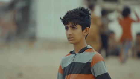 Profile-view-of-small-Pakistani-boy-in-Balochistan,-Pakistan