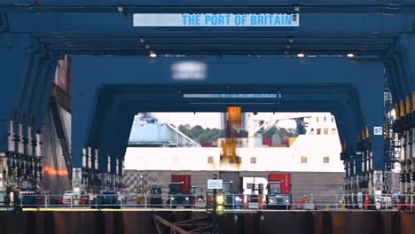 Automated-and-manned-vehicles-offloading-containers-at-deep-sea-port-transporting-cargo