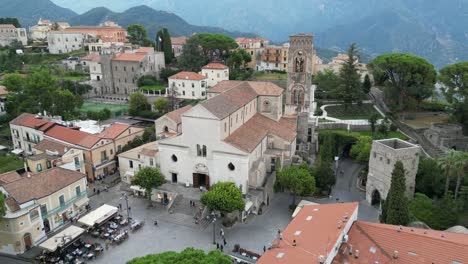 Drone-shot-of-Ravello's-Cathedral-sitting-amidst-the-Italian-buildings-of-Ravello
