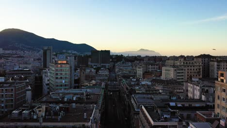Aerial-view-low-over-the-cityscape-of-Genova-city,-sunny-morning-in-Liguria,-Italy