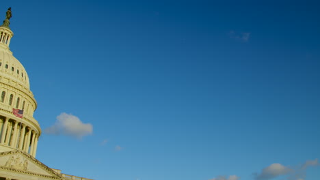 The-white-limestone-of-the-United-States-Capitol-building-shines-during-sunrise-as-the-camera-pans-left