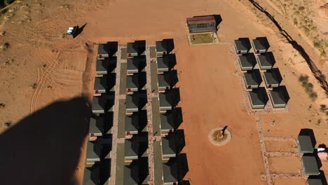 Aerial-view-around-huts-at-a-holiday-resort-in-Saudi-Arabia---circling,-drone-shot