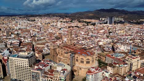 Malaga-cathedral-landsmark-old-town-Spanish-city-historical-buildings-aerial-drone-footage