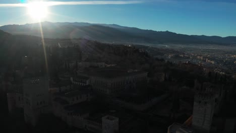 Aerial-View-Of-Alhambra-Palace-During-Sunrise-In-Granada,-Spain---Drone-Shot