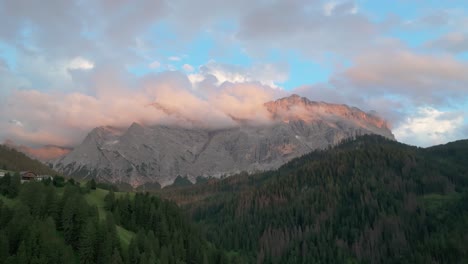 An-evening-aerial-footage-of-the-Sas-dles-Nü-mountain-covered-in-beautiful-clouds