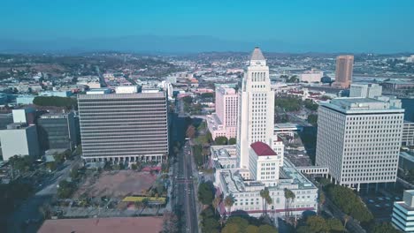 Los-Angeles-City-Hall---Drone-Flight-Over-Downtown-Area---Palm-Trees-And-City-Streets