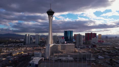 Las-Vegas-USA,-Aerial-View-of-North-Strip-Buildings-at-Sunset,-The-Strat-Tower-and-Neighborhood,-Drone-Shot