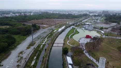 Drone-Shot-of-Japan-river-and-buildings-infrastructure-in-the-city-of-Yokohama