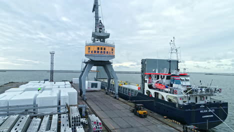 Cargo-ship-and-containers-at-port-in-Liepaja,-Latvia---aerial