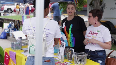 Festival-attendees-visit-the-City-of-Columbia,-MO's-Health-Department-booth-during-the-MidMo-PrideFest