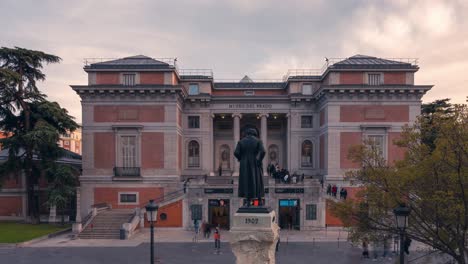 Close-up-detail-timelapse-shot-of-Museo-del-Prado-during-sunset-with-tourists-and-visitors