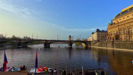 -Iconic-Charles-Bridge-in-Prague-spans-the-Vltava-River,-offering-breathtaking-view-of-city's-historic-landscape