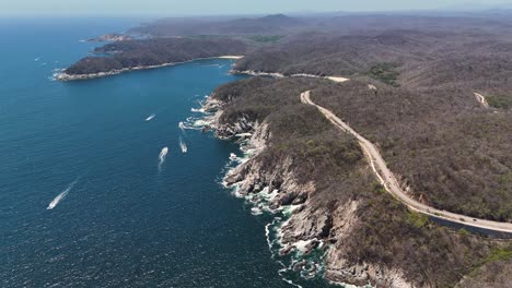 Aerial-Views-of-mountains-and-beaches-in-Huatulco-Bays,-Oaxaca,-Mexico