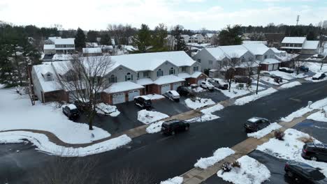 American-neighborhood-covered-in-snow-on-sunny,-bright-day