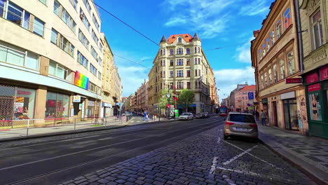 Tram-passing-on-European-city-street-intersection-on-a-sunny-day