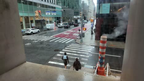 A-stationary-time-lapse-of-an-intersection-in-New-York-City-on-a-rainy-day