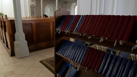 Shelf-of-Bibles-inside-sanctuary-of-reformed-Lutheran-church