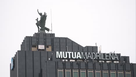 Spanish-automobile,-health,-accident-insurance,-and-investment-funds-company-Mutua-Madrilena-logo-is-seen-on-top-of-a-building-in-Spain