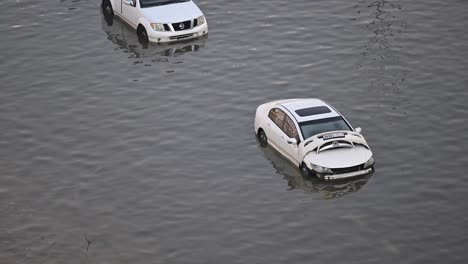 On-April-19,-2024,-cars-were-flooded-on-a-street-in-the-northern-Emirates-due-to-record-breaking-rains-in-the-UAE