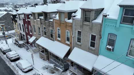 Colorful-Row-of-Houses-in-Low-Income-District-of-American-Town-in-winter-snow