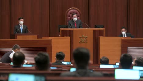 John-Lee-Ka-chiu-,-Hong-Kong's-chief-executive,-delivers-in-front-of-lawmakers-the-annual-policy-address-at-the-Legislative-Council-building-main-chamber-in-Hong-Kong