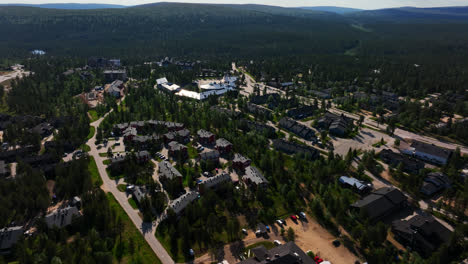 Aerial-tracking-shot-of-the-Saariselka-town,-sunny-summer-day-in-Lapland,-Finland