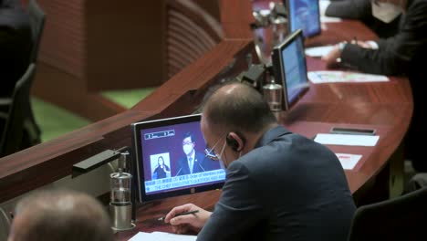 Lawmakers-listen-to-John-Lee-Ka-chiu,-Hong-Kong's-chief-executive,-delivering-the-annual-policy-address-at-the-Legislative-Council-main-chamber-in-Hong-Kong