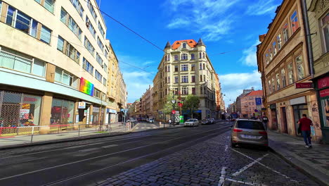 Shot-of-tourists-and-locals-pass-by-shops-and-cafes-in-a-picturesque-section-of-Old-Town-Prague,-Czech-Republic-on-a-sunny-morning