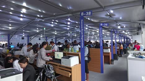 Registration-processing-of-oversea-international-buyers-at-Canton-Fair-Import-and-export-exhibition-in-Guangzhou,-China