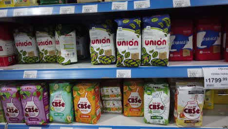 Yerba-mate-products-at-supermarket-shelf-in-argentina-prices-packets-of-drink-traditional-herbal-tea,-south-american-hot-beverage-industrial-goods